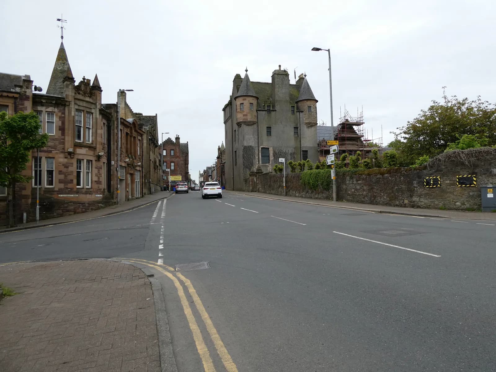Maybole High Street, with the turreted Maybole Castle beside the road